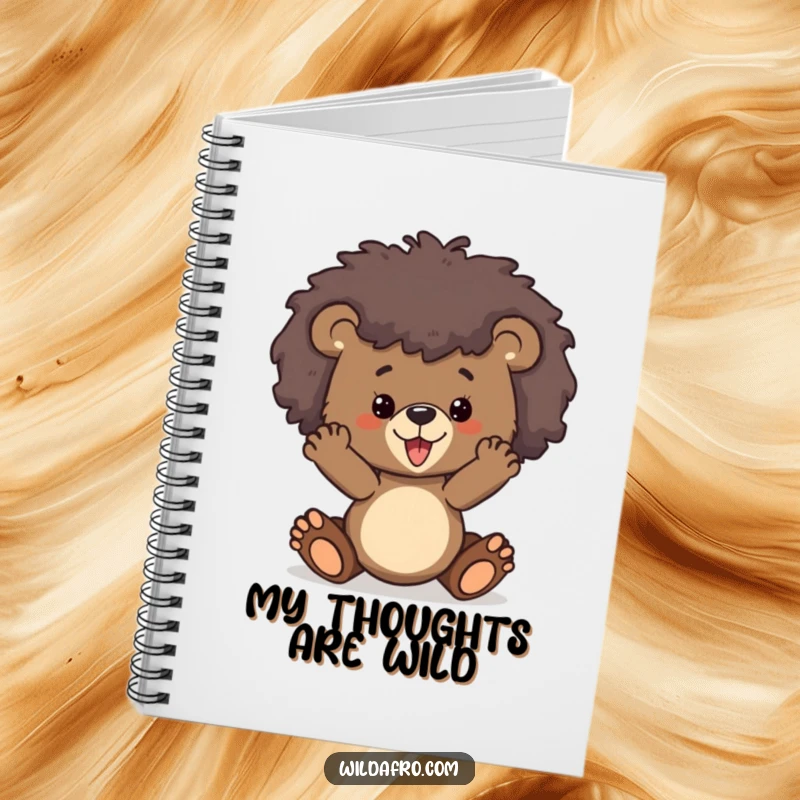 Funny bear cub with a stylized wild afro on the cover of a notebook, ready for writing and creativity.